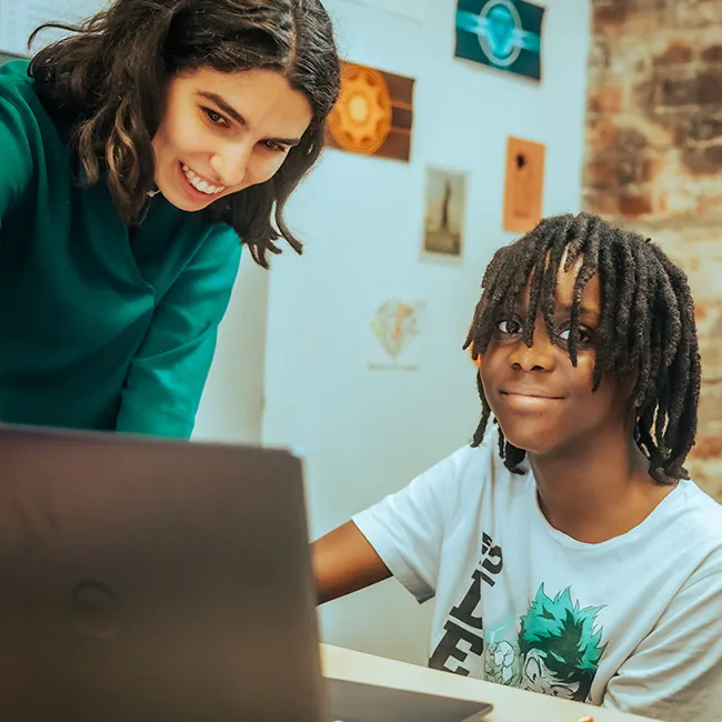 Templeton Academy student and teacher working together on a laptop